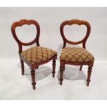 Eight Victorian walnut dining chairs, each with trefoil hoop back, stuffover seat, on turned