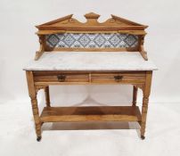 Vintage washstand, the tile back above the marble top, two drawers, on turned and ring supports to