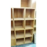 Modern stacking unit of assorted cubes, one with pair of drawers, comprising three larger units,
