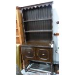 20th century oak dresser with two shelves above two cupboard doors, on barleytwist and block