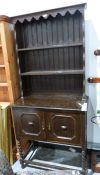 20th century oak dresser with two shelves above two cupboard doors, on barleytwist and block