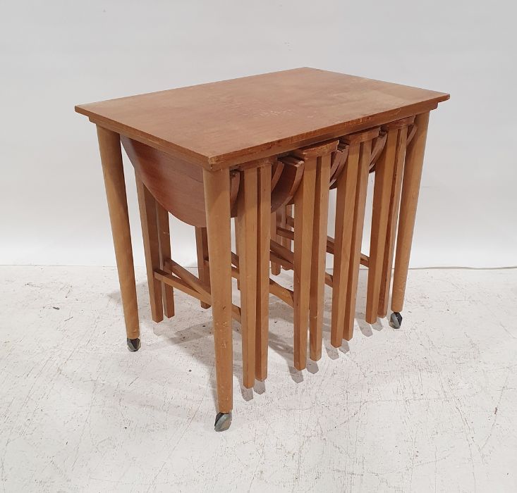 In the manner of Paul Hundevad mid-century modern teak nesting coffee tables