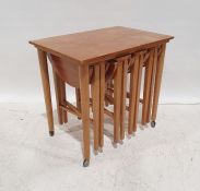 In the manner of Paul Hundevad mid-century modern teak nesting coffee tables