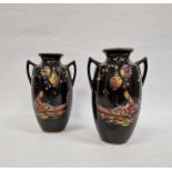 Pair 20th century pottery vases, ovoid and two handled, black ground and decorated with figures in