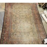 Persian herati-type rug, the cream ground with allover foliate decoration to the central field, on a