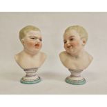 Pair German bisque porcelain pedestal busts of babies, one with happy face, one with sad face,