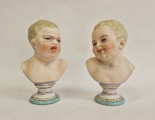 Pair German bisque porcelain pedestal busts of babies, one with happy face, one with sad face,