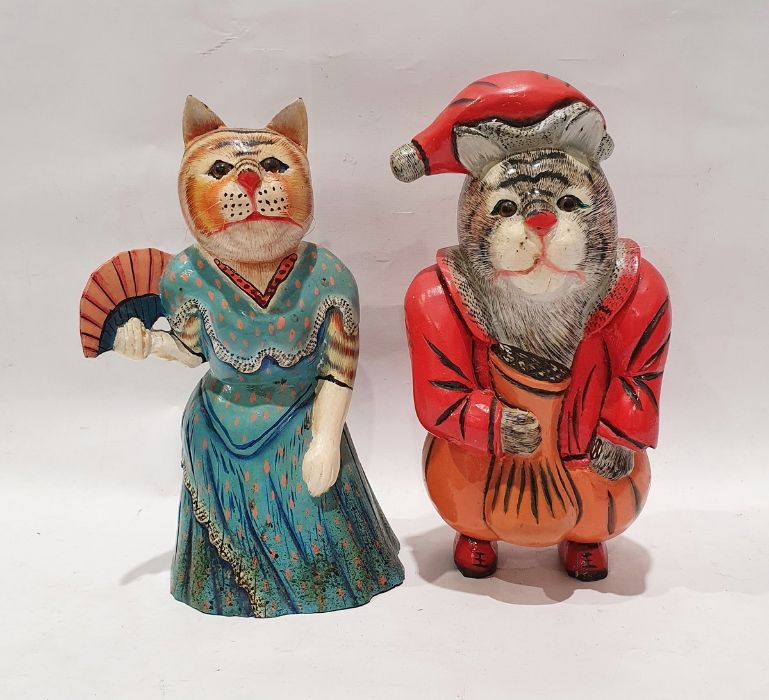 Pair of wooden carved and hand-painted novelty cat figures, to include ginger cat dressed in a dress