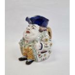 French faience Toby style jug, portly gentleman wearing floral jacket, striped waistcoat, probably