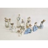 Lladro girl with lamb, another with rabbit, anothe