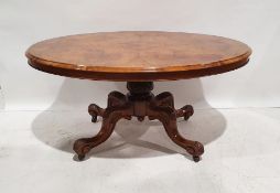 Victorian oval walnut loo table, the oval top with moulded edge, on turned and carved pedestal