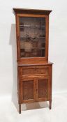 Edwardian oak and leadlight glazed cabinet, the moulded cornice above the leaded glazed door