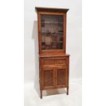 Edwardian oak and leadlight glazed cabinet, the moulded cornice above the leaded glazed door