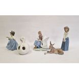 Nao girl with swan, two Nao figures of girls,  Lladro figure of a donkey and a Lladro swan pot