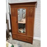 Edwardian mahogany and inlaid wardrobe with moulded cornice above single mirrored door, above single