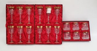 Two boxed sets of six Interglass wine glasses with etched floral decoration, gilt rim and gilt edged