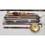 Quantity of mainly modern walking sticks and umbrellas and a warming pan, to include examples with