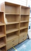 Pair of modern oak shelves with rounded top and bottom corners, four shelves above two drawers,