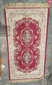 Modern silk cream ground rug with two floral medalions with floral border 146cm x 79cm