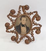 Nineteenth century miniature on paper, half-length portrait of Victorian gentleman in black