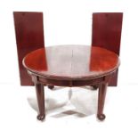 20th century mahogany extending D-end table with moulded edge, on turned supports to pad feet,