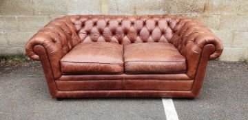 Modern two-seater brown leather Chesterfield sofa  Condition ReportSlightly worn - as expected -