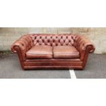 Modern two-seater brown leather Chesterfield sofa  Condition ReportSlightly worn - as expected -