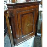 George III inlaid oak and mahogany wall-hanging corner cabinet having stepped and cavetto