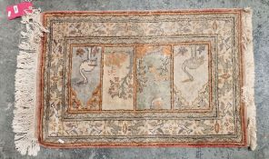 Three Turkish rugs to include cream ground rug with tree design, floral border, orange ground rug