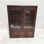 Dark elm Ercol display cabinet with two glazed doors above the fall, 126cm x 98cm x 29.5cm