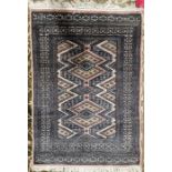 Modern cream ground rug with geometric pattern flanked by multiple geometric guard stripes 124cm X