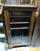 Victorian inlaid rosewood music cabinet with brass three-quarter gallery top, enclosed by single