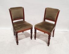 Set of four early 20th century dining chairs with upholstered seats and backs, on turned front legs