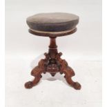 Victorian mahogany circular piano stool, on turned and carved base and ogee carved legs