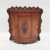 Mahogany wall-hanging bowfront corner cabinet with moulded decoration, 54cm x 34cm x 34cm