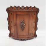 Mahogany wall-hanging bowfront corner cabinet with moulded decoration, 54cm x 34cm x 34cm