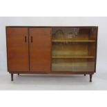 Meredew teak bookcase with two cupboard doors and glass doors encasing shelves, turned supports,