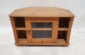 Pine television stand with single glazed door, on bun feet, 53cm x 88cm x 51cm