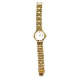 Lady's Citizen yellow metal wristwatch with baton numerals and date aperture.  Flexible mesh strap