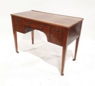 Sheraton-style kneehole writing table, the top with quadrant mould edge fitted single frieze drawer,