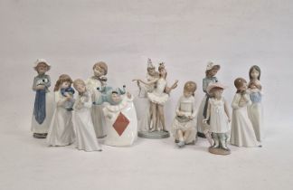 Lladro figure group ballerina and clown, two Nao girls with puppies, Nao girl seated with blackboard