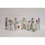 Lladro figure group ballerina and clown, two Nao girls with puppies, Nao girl seated with blackboard