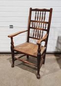 Lancashire-style armchair with spindle back, rush seat, on turned front stretcher