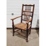 Lancashire-style armchair with spindle back, rush seat, on turned front stretcher