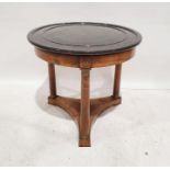 Empire-style centre table, the turned black marble top on walnut base with three column supports