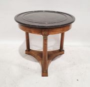 Empire-style centre table, the turned black marble top on walnut base with three column supports