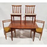 Mid century modern teak extending table by Elliotts of Newbury, on cylindrical tapering supports