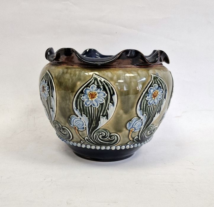 Doulton Lambeth stoneware jardiniere with wavy inverted rim, the green body with blue floral and