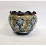 Doulton Lambeth stoneware jardiniere with wavy inverted rim, the green body with blue floral and