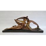 Art Deco large bronzed-effect plaster figure of girl reclining the side with eagle on rock, on black